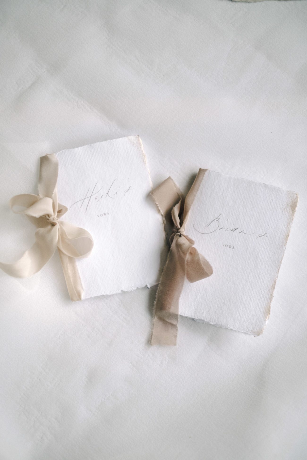 vow books with neutral beige silk ribbon