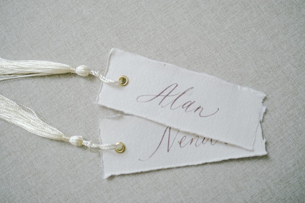 Place Cards with gold eyelet and Tassels