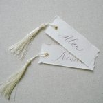 Place Cards with gold eyelet and Tassels