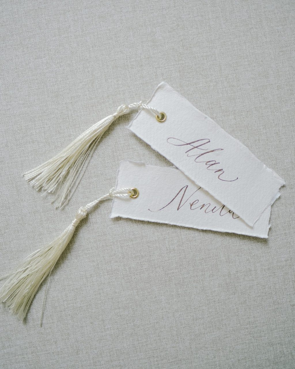Place Cards with gold eyelet and Tassels